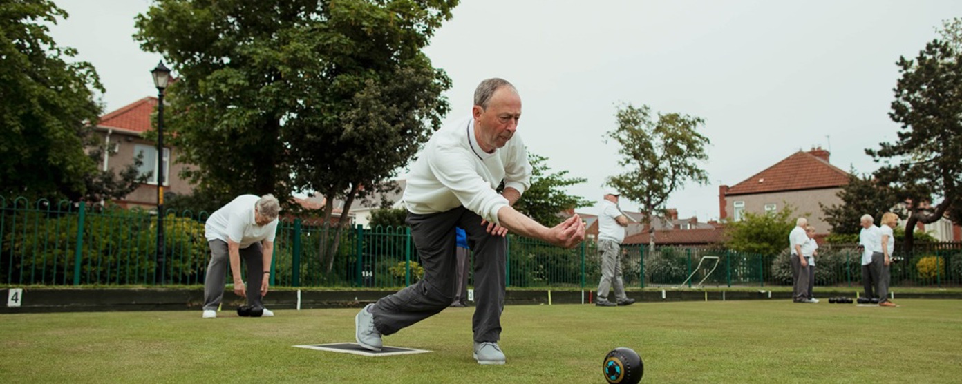 Older man playing bowls