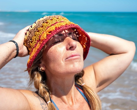  Lady in a sunhat on the beach