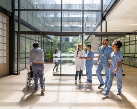 Hospital corridor staff and patients