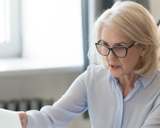 older-and-young-women-looking-at-a-laptop-screen